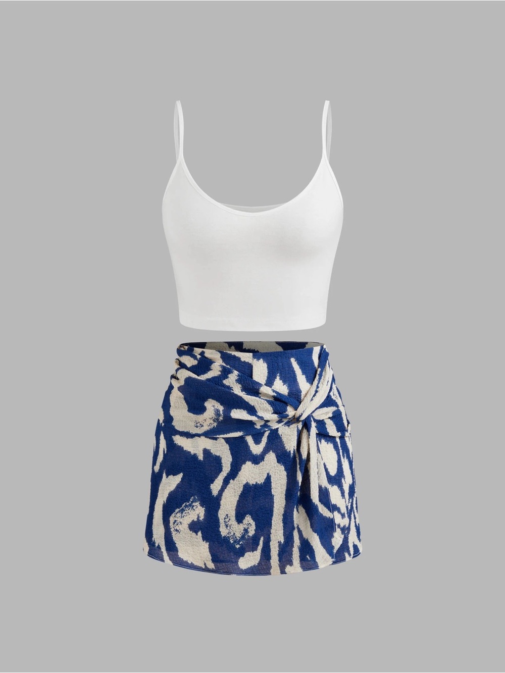 Cider round neckline crop top cami with mid rise abstract knotted mini skort